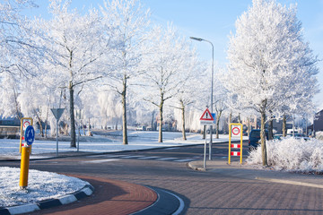 Fototapeta na wymiar Residential area with traffic circle in wintertime