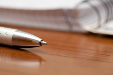 Silver pen on a table
