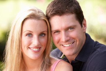 Fototapeta premium Portrait Of Young Couple Relaxing In Park