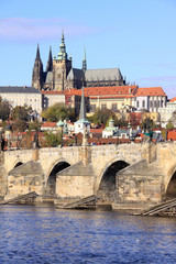 Obraz premium View on the autumn Prague gothic Castle with the Charles Bridge