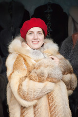 Woman  chooses fur coat