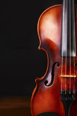 Fototapeta premium Vintage violin on black background