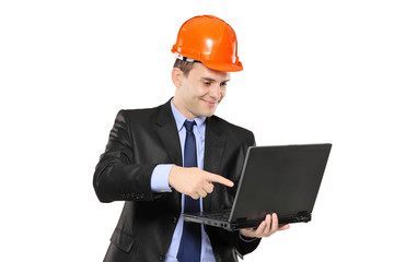 An architect pointing at a laptop