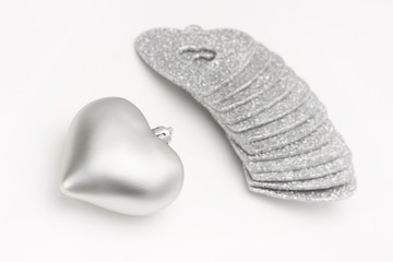 Christmas baubles, decorative hearts on white background