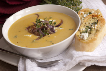 Butternut squash soup with goat's cheese and onion