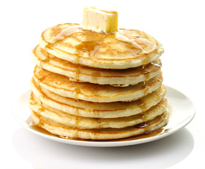 Golden pancakes with butter and maple syrup.