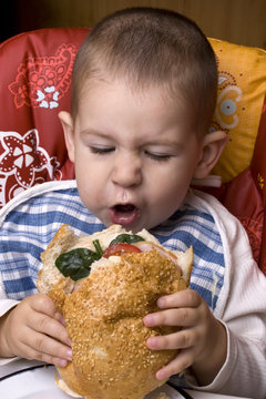 boy eating hamburger