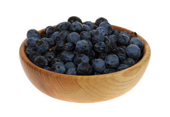 sloe, blackthorn in a wooden mortar (Prunus spinosa)