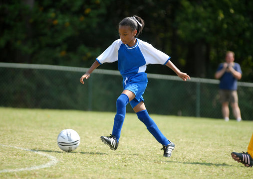 Fototapeta girl playing soccer