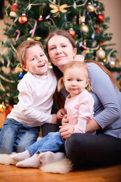 Family near Christmas tree