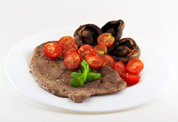 Steak with tomatoes and mushrooms