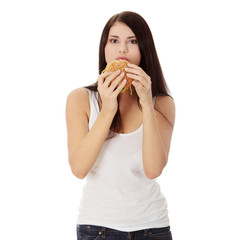 Woman eating hamburger