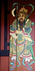 Old wooden door with Chinese door-god on