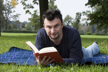 Young Adult Reading at the Park