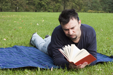Young Adult Reading at the Park