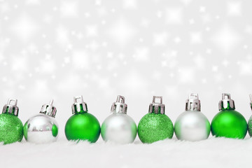 green and silver balls in a row