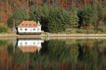 Naklejka na ściany i meble View of a lake house on Ighiu lake, Romania
