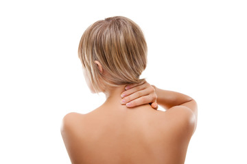 Woman massaging pain back isolated on white