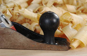 Black metal wood planer and shavings