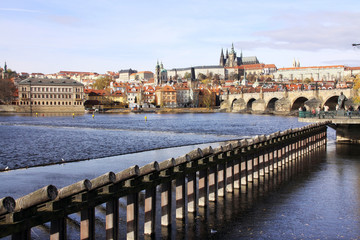 Obraz premium View on the autumn Prague gothic Castle with the Charles Bridge