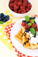 Tasty waffles with summery fruits