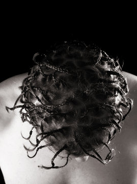 caucasian man with mutliple african-style plaits