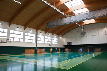Fototapeta interior of a modern multifunctional gymnasium with young people obraz
