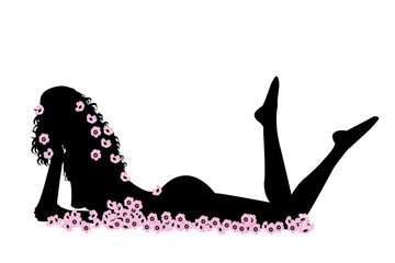 Femme sexy nue au milieu des fleurs roses