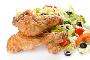 Roasted chicken legs with salad