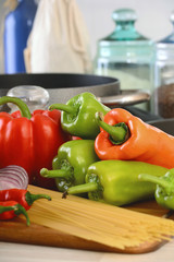 Composition with raw vegetables on kitchen table