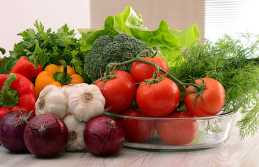 Composition with raw vegetables on kitchen table