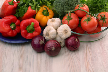Composition with raw vegetables on kitchen table