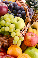 Composition with fruits and wicker basket