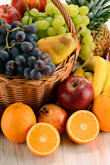 Composition with fruits and wicker basket