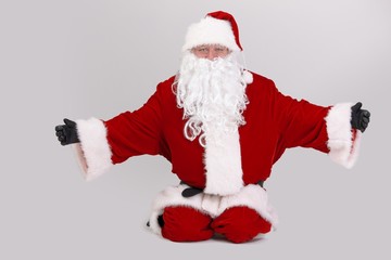 Santa kneeling outspreading arms