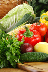 Composition with raw vegetables and wicker basket