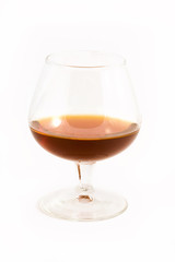brandy in glass over white