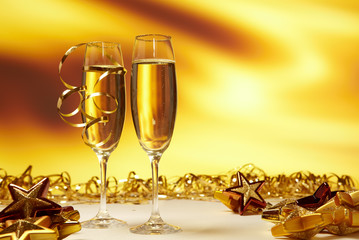 Glass of champagne against golden background