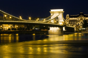 Obraz premium Budapest bridge illuminated at night..