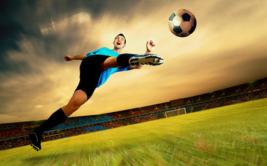 Happiness football player on field of olimpic stadium on sunrise
