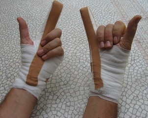 bandaged hands with horns