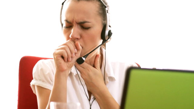 Sick female helpdesk consultant coughing