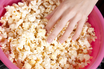 hand in popcorn