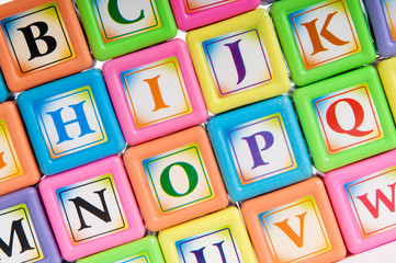 Fototapeta na wymiar Learning and education concept - pile of alphabet blocks