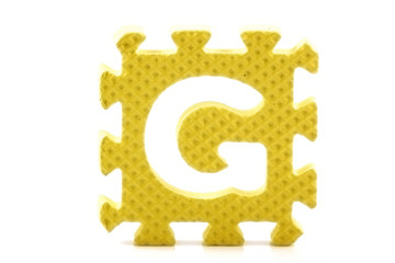 Alphabet puzzle pieces on white background