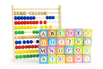 Alphabet blocks and abacus isolated on white