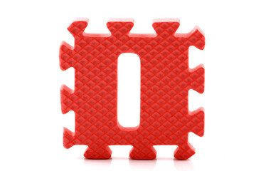 Alphabet puzzle pieces on white background