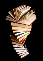 Pile of books on a black background