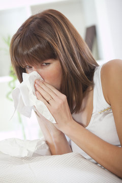 sick woman with handkerchief