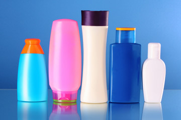 bottles of health and beauty products on blue background